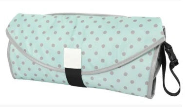 Waterproof portable baby changing pad in various colors, perfect for on-the-go nappy changes