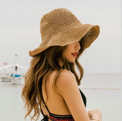 Women's foldable straw sun hat with wide brim for summer sun protection