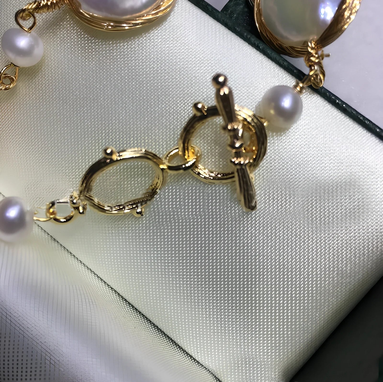 14K gold bracelet with 14mm white button freshwater pearls and baroque texture