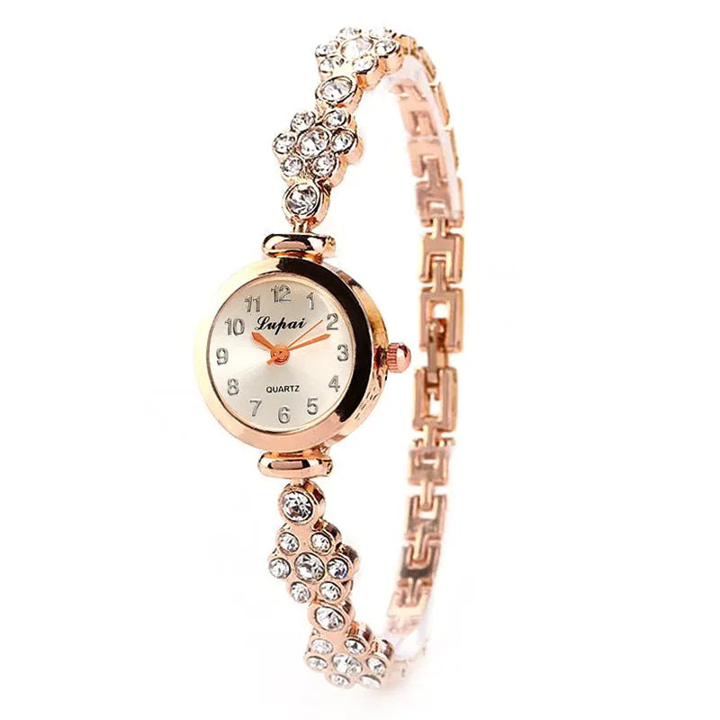 Ladies flower bracelet watch with round dial and silicone strap in gold colour