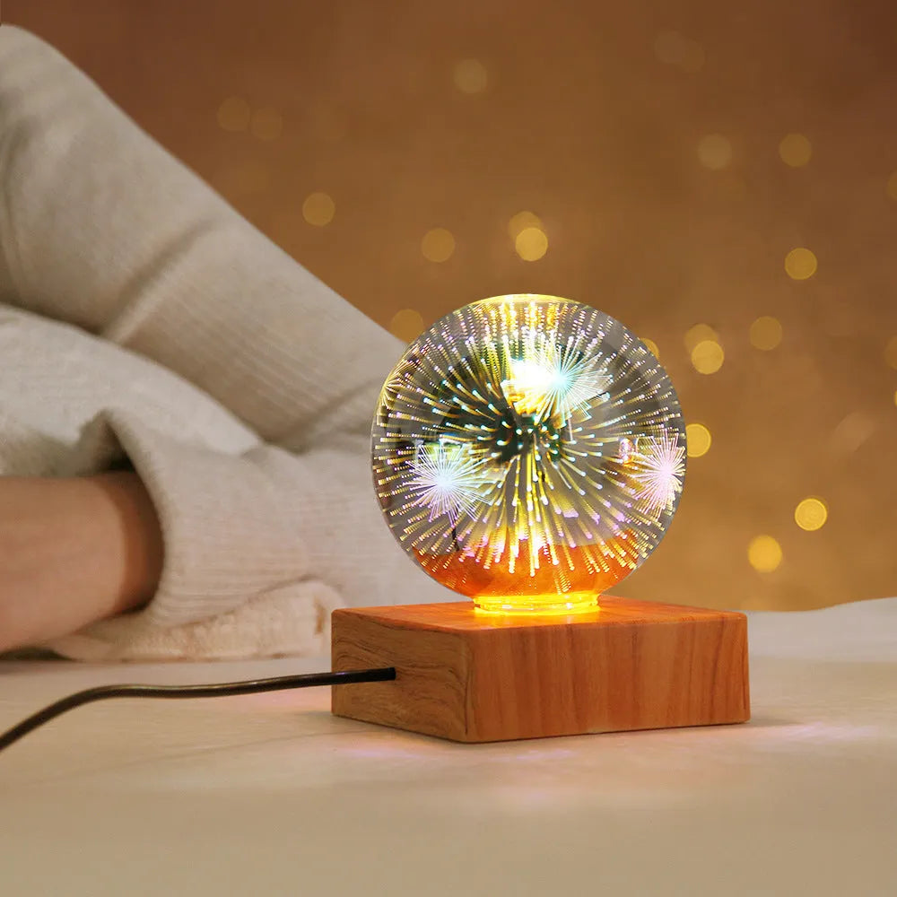 Spherical USB touch control LED night light showing starry sky pattern on a desk.