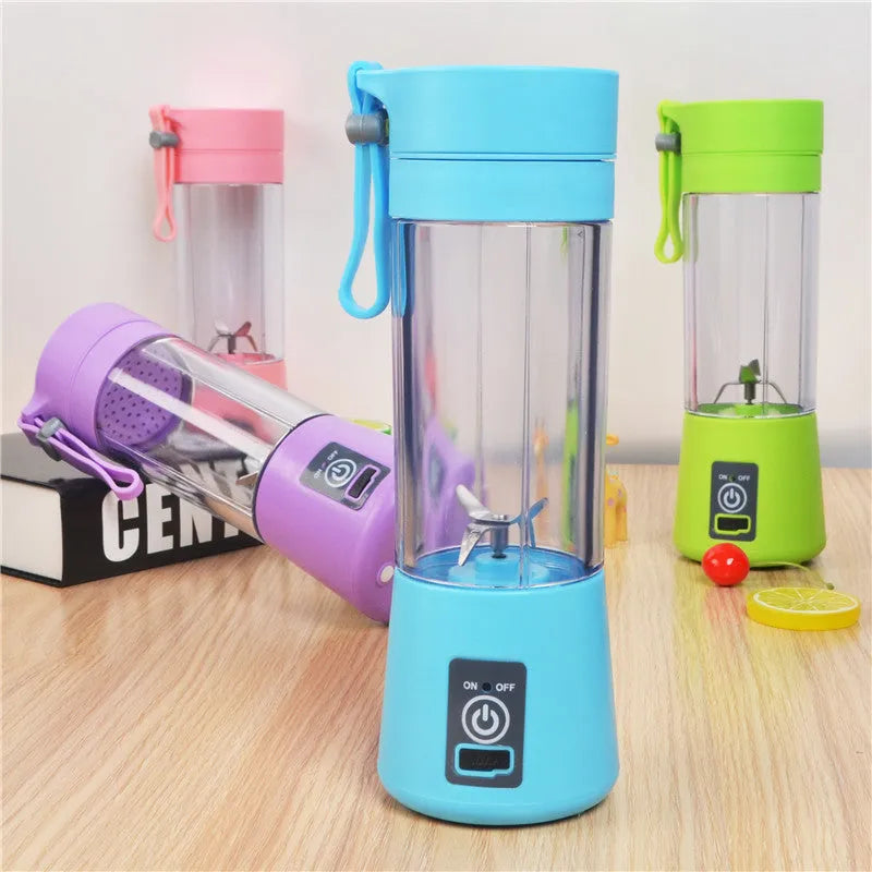 Mini USB-powered handheld fruit juicer with green plastic housing and a stainless steel blade.