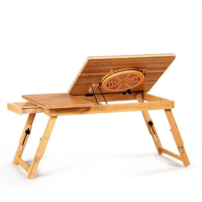 Foldable laptop bed desk with storage drawers and small fan, made from natural bamboo