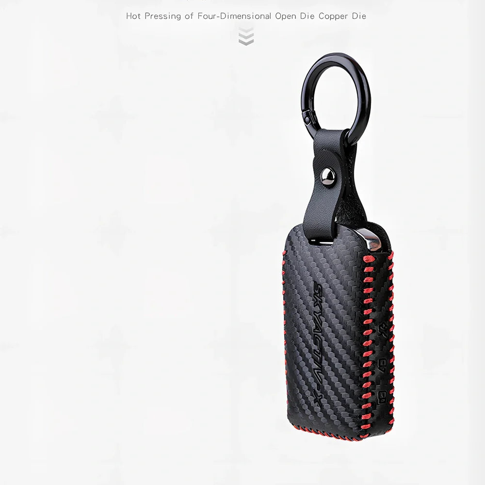 Black Angkesaila leather key case with 3D carbon fibre pattern and red stitching, 10 cm size for fob protection