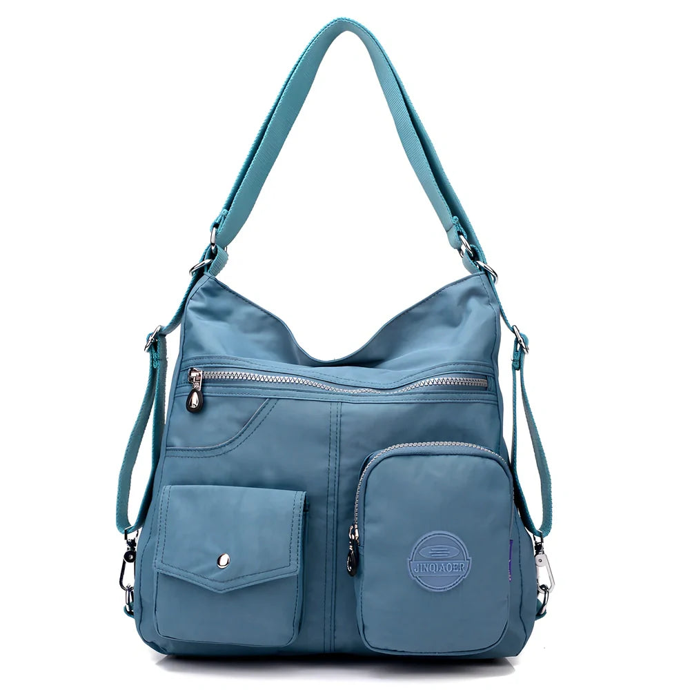 Women's waterproof nylon crossbody bag with organizational pockets and 34cm laptop capacity