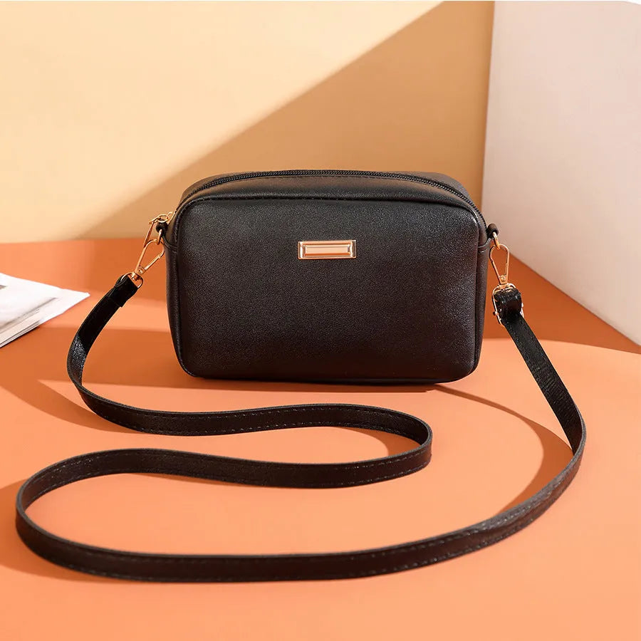 PU ladies' shoulder bag in solid colour with three-dimensional pocket and urban simplicity design