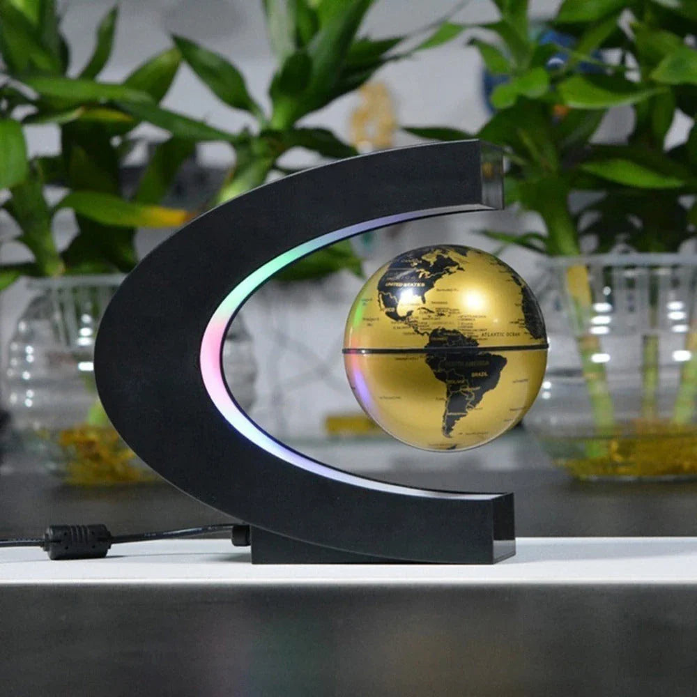 Magnetic levitation globe floating above base with LED light on