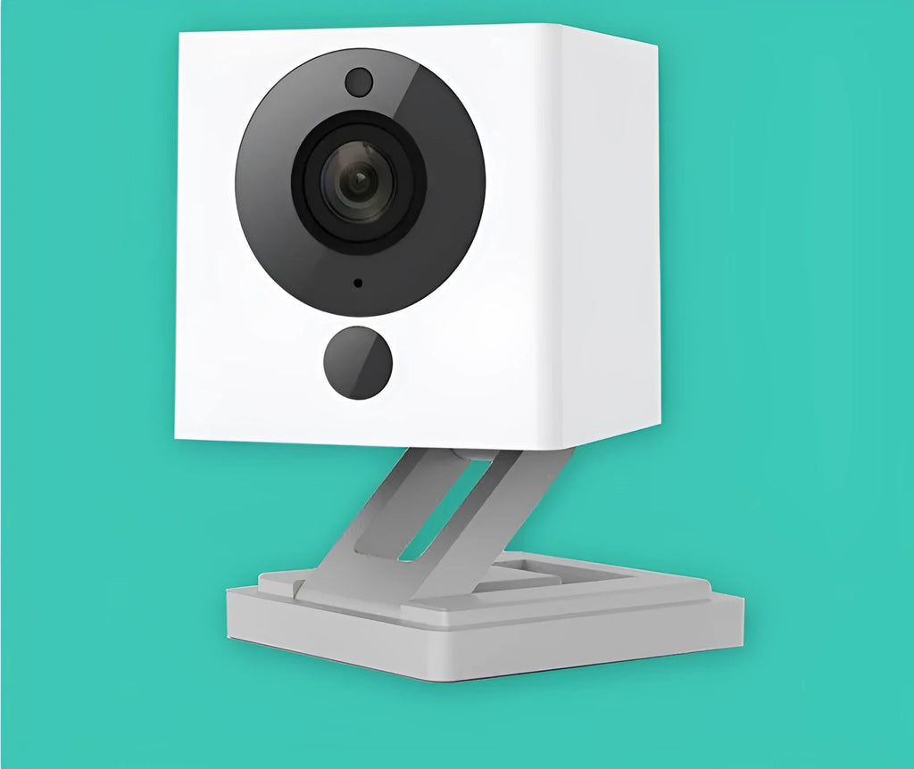 Small white 1080P Wi-Fi indoor security camera with wide-angle lens and night vision