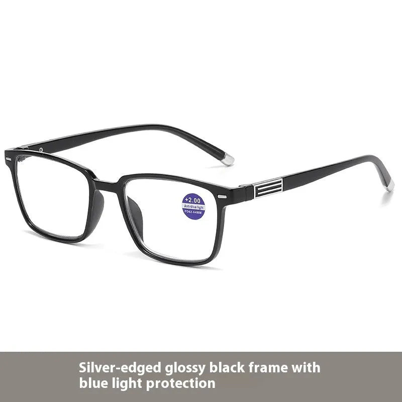 A pair of multifocal reading glasses with colour changing, anti blue light PC lenses in a black and silver frame style.