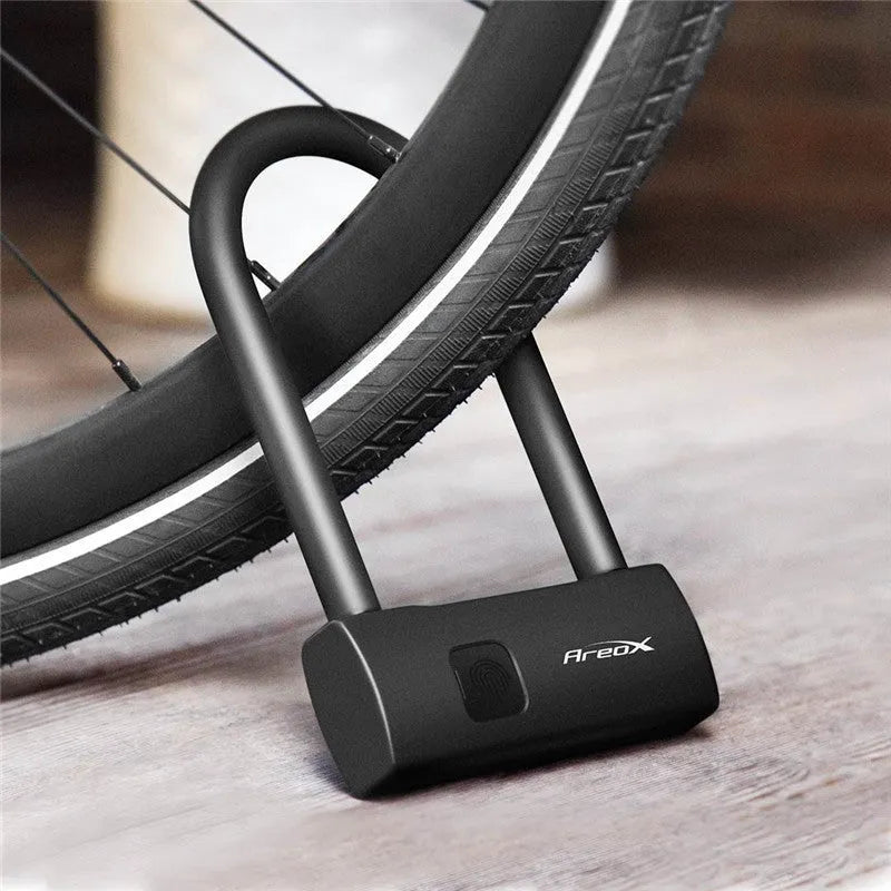 Smart fingerprint U-shaped lock with stainless steel beam, PVC wrap, and fingerprint sensor on black background