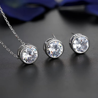 Bride and bridesmaid fashion jewellery set featuring diamond-treated pendant and matching earrings for wedding coordination