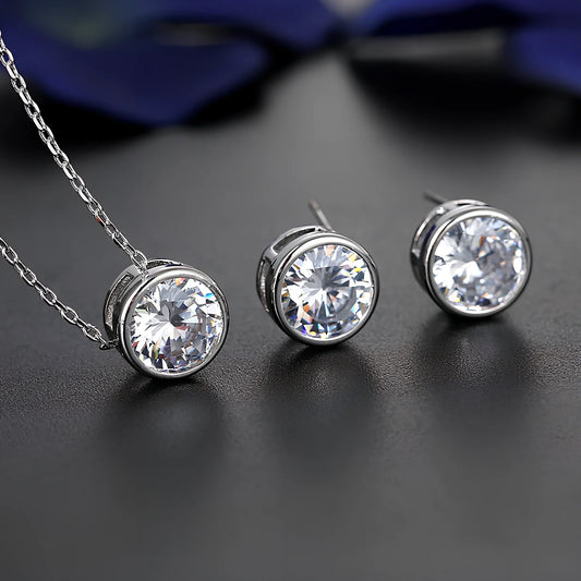 Bride and bridesmaid fashion jewellery set featuring diamond-treated pendant and matching earrings for wedding coordination