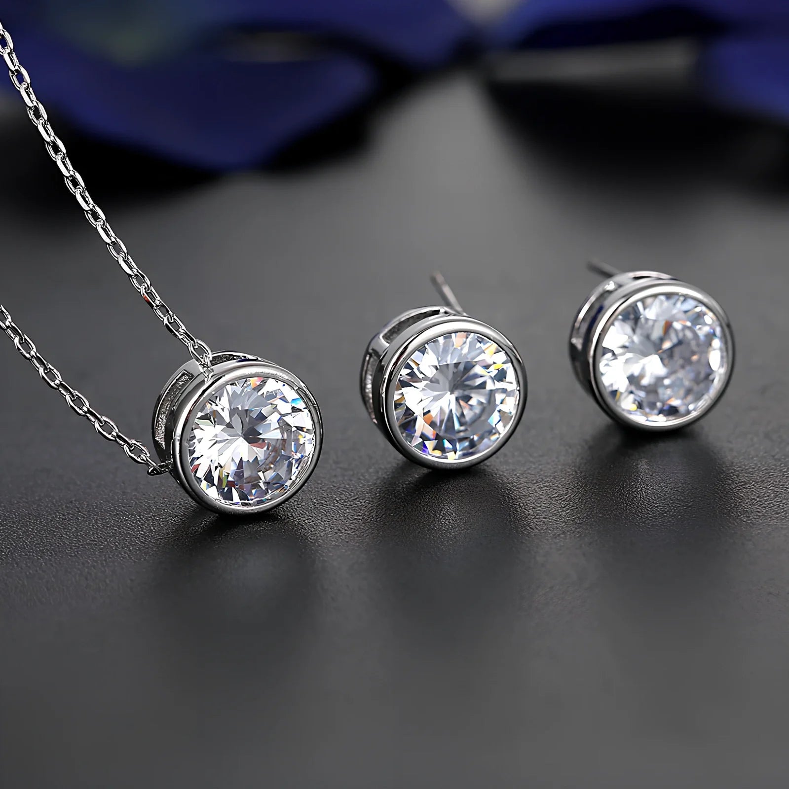 Bride and bridesmaid fashion jewellery set featuring diamond-treated pendant and matching earrings for wedding coordination