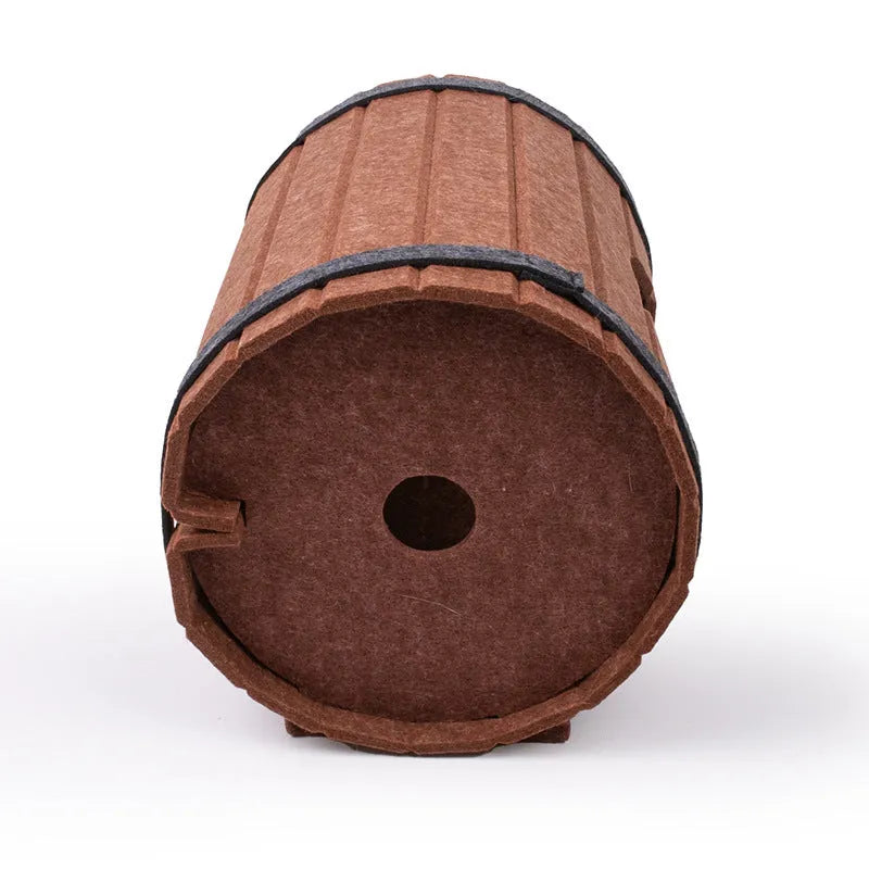 Assembled wine barrel cat bed with three felt panels forming circular pet nest