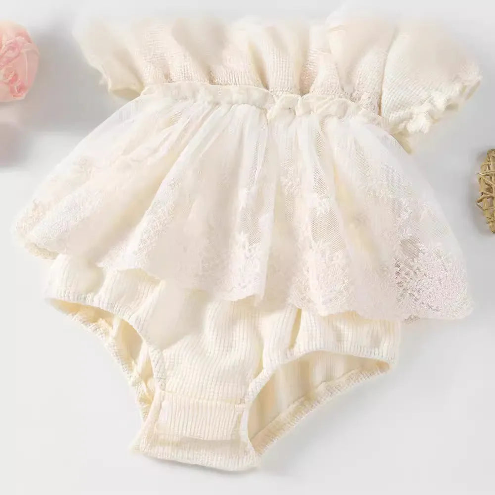 Apricot cotton triangle jumpsuit for girls with short sleeves and single-breasted closure on a white background