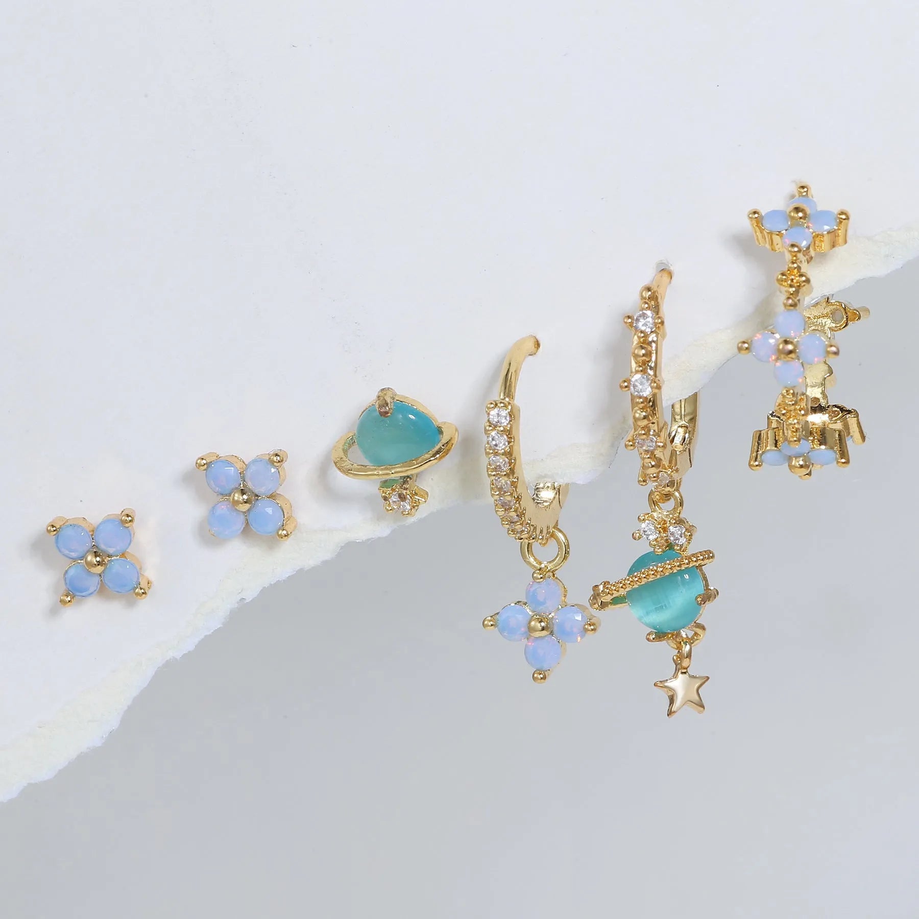Gold and silver flower stud earrings with blue protein flower nail and zircon mosaic design.