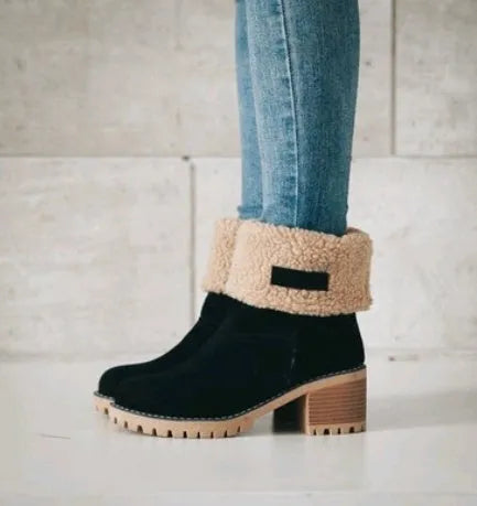 Women's black suede mid-calf Martin boots with a round toe and low flat heel.