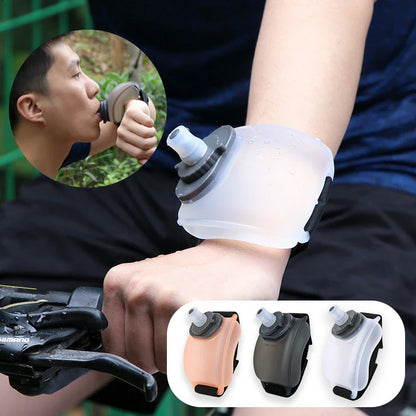 Portable sports water bottle with wrist strap for hands-free hydration during cycling, running, and fitness activities