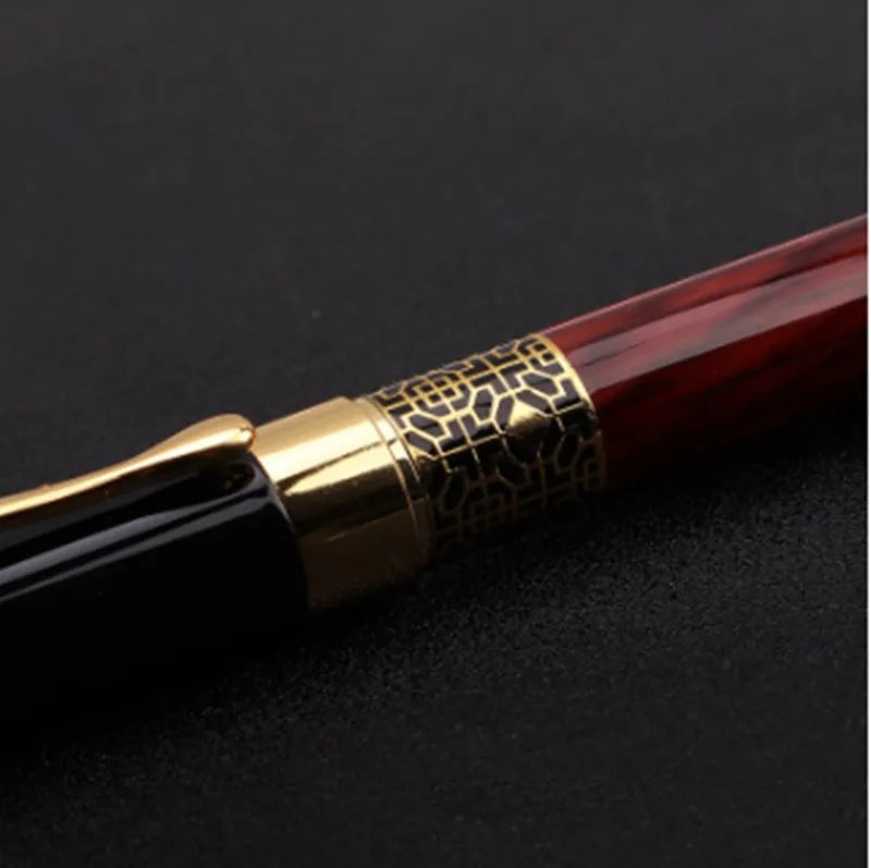 Imitation mahogany metal wood grain fountain pen with 0.5mm tip and black ink refill on desk