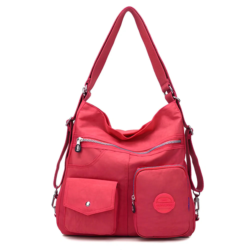 Women's waterproof nylon crossbody bag with organizational pockets and 34cm laptop capacity