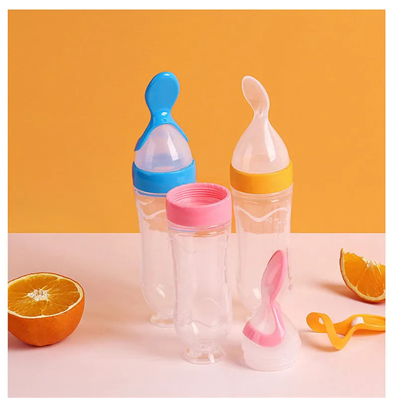 Pack of 12 clear plastic disposable champagne flutes in assorted colours on a table.