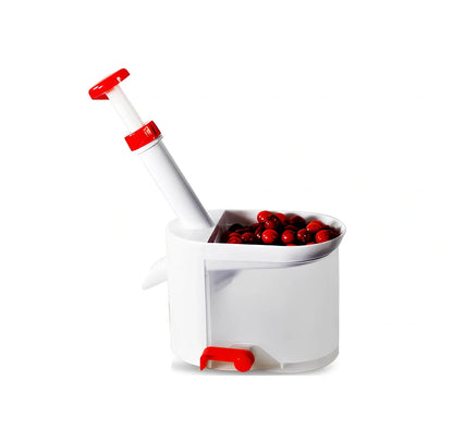 White cherry nucleator fruit cutter with stainless steel blades and plunger mechanism for cutting grapes
