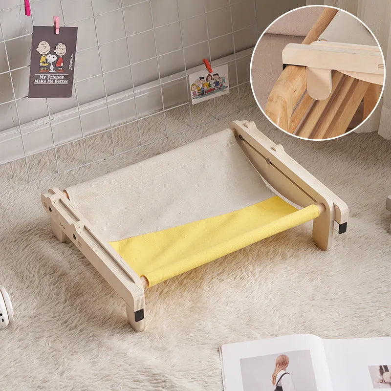 Solid wood raised pet bed with removable cushion in plaid pattern for cats and dogs