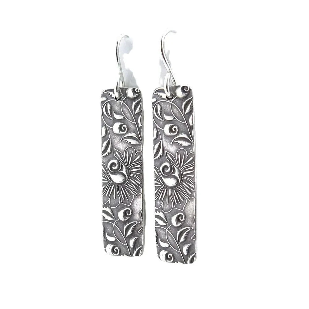 Silver geometric long drop earrings with carved vine patterns and retro design