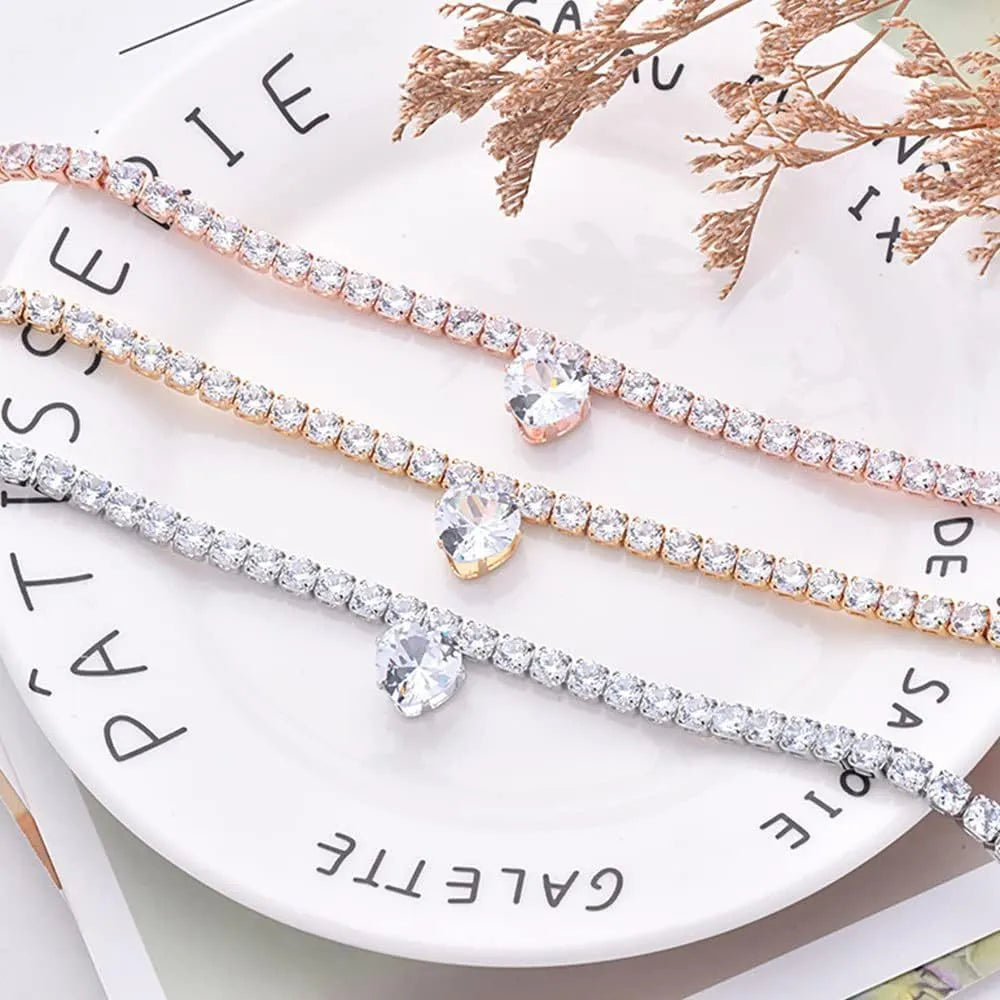 Gold rhinestone heart shaped pet collar with extension chain on white background
