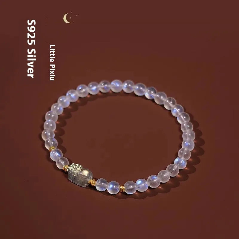 National style moonstone bracelet with animal zodiac design showing blue light fashion effect