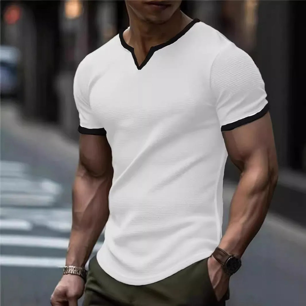 Colour-block V-neck sports t-shirt in waffle-knit polyester fabric on a hanger.