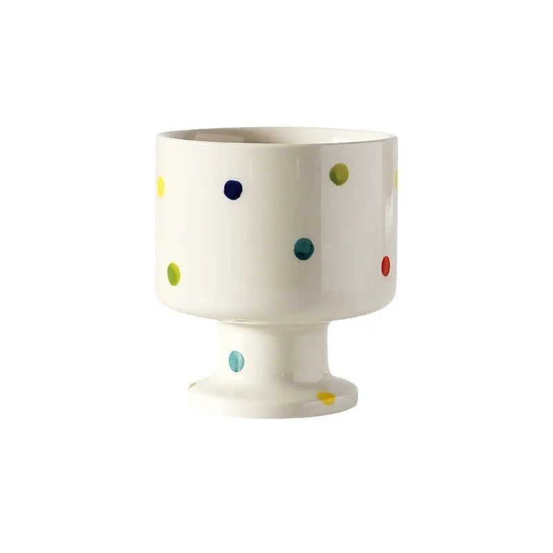 Hand-pinched irregular ceramic mug in a solid colour on a plain background.