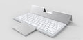 Black and grey wireless Bluetooth keyboard with touchpad next to its leather sheath stand.