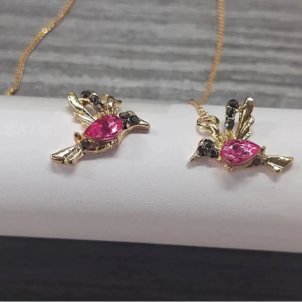 Long, dangling bird-shaped earrings with zirconium wing details in red, blue, and red lvzuan colour options.