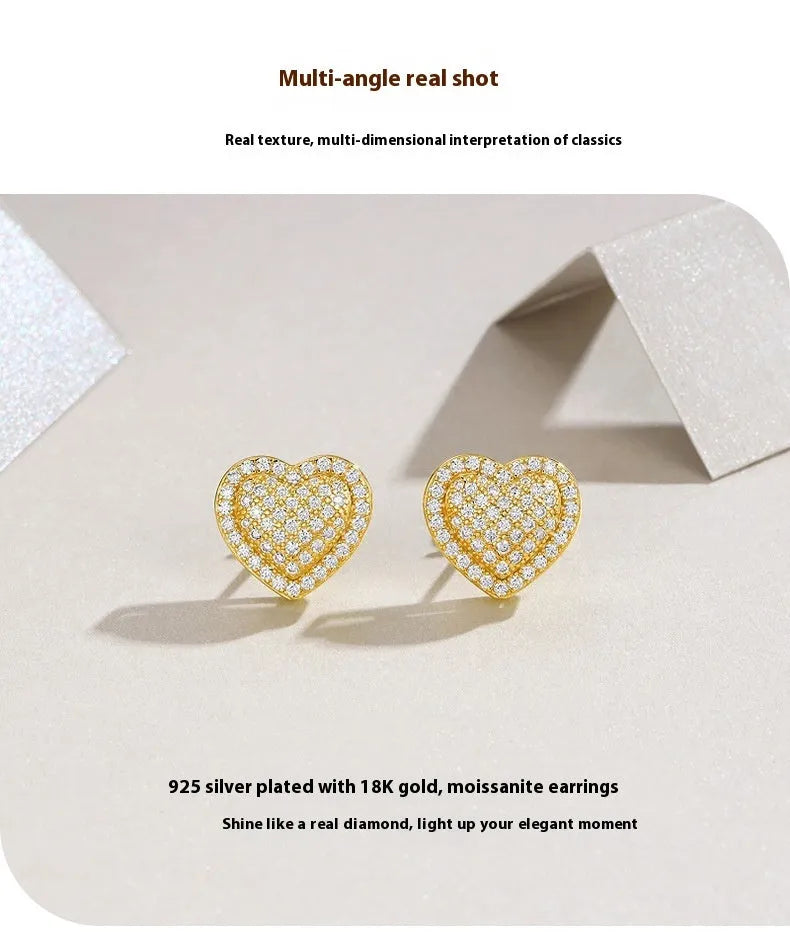 Golden heart-shaped stud earrings made from S925 silver with gold plating.