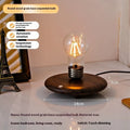 Modern suspension bulb desk night lamp with iron art construction and black wood grain base.