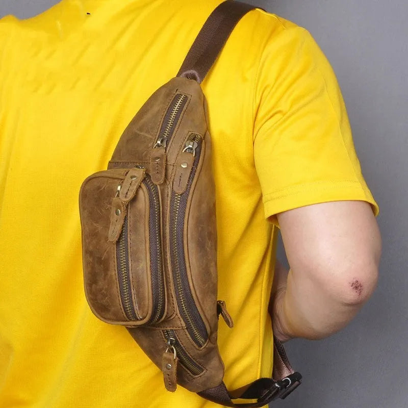 Brown leather shoulder messenger bag with single strap showing dimensions of 32x15x9cm