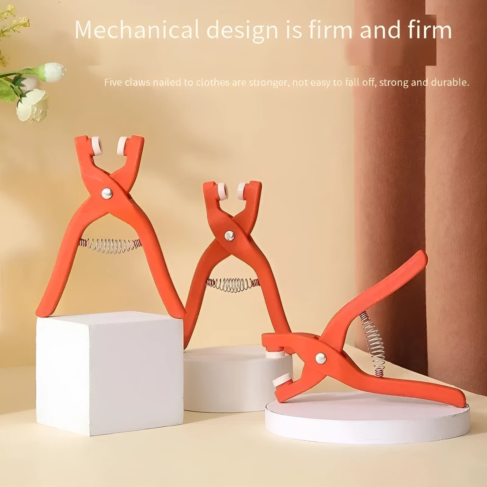 Stainless steel five-claw no-sew buttons and pliers for children's clothing.