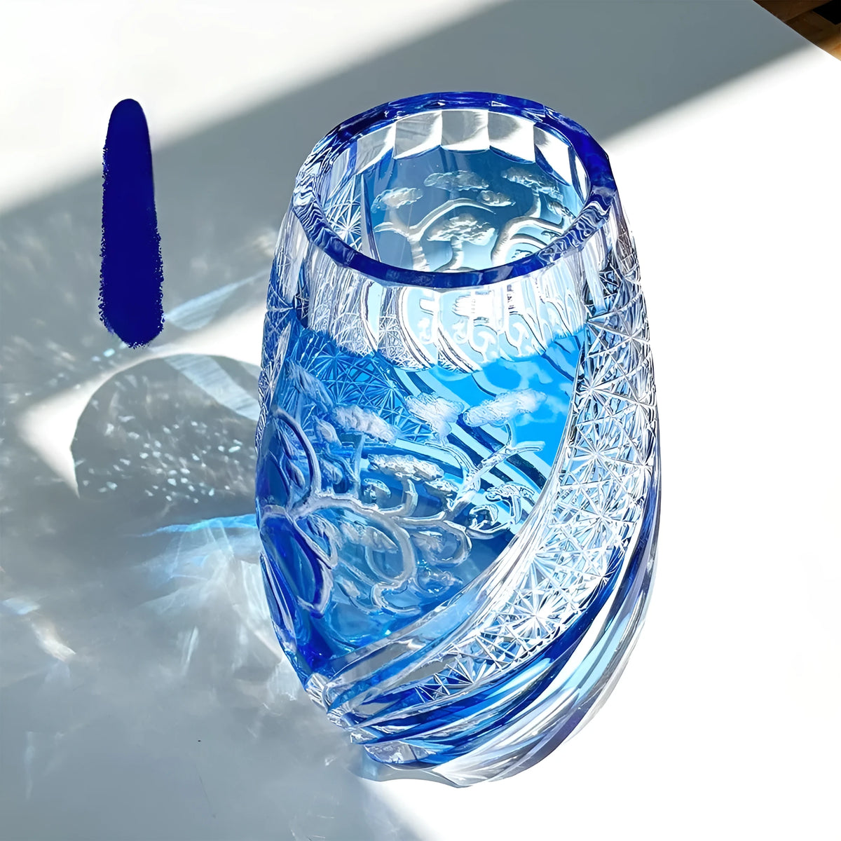 Blue Jianghu cut crystal glass tumbler 80x190mm on a table