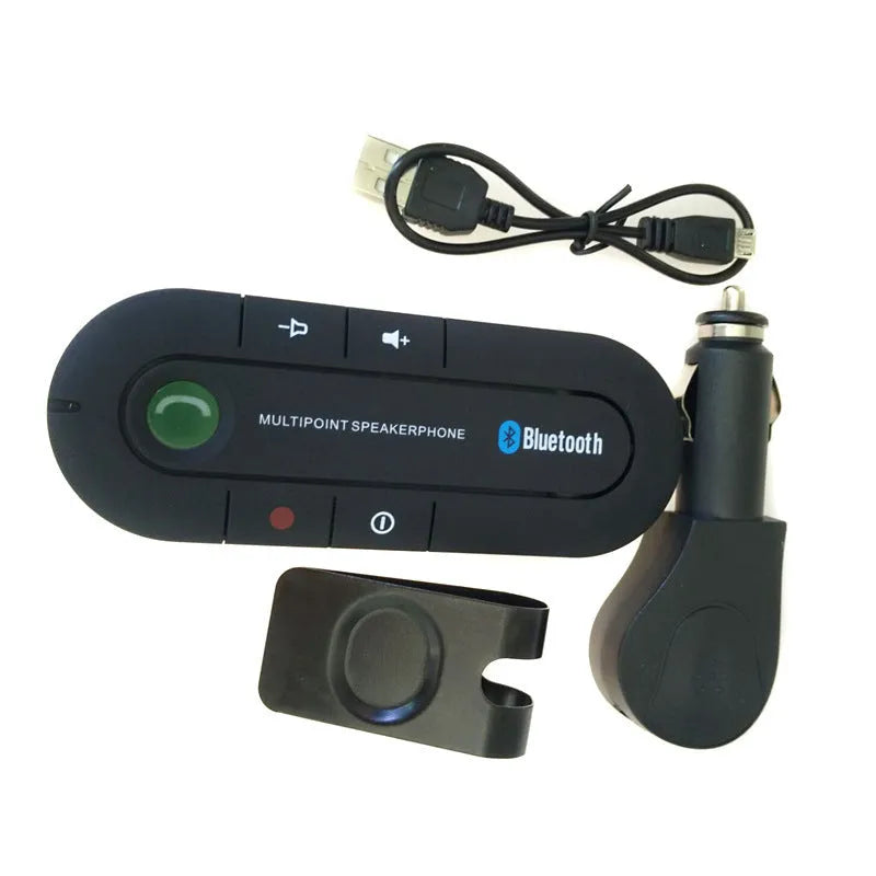 Black vehicle-mounted Bluetooth handsfree device clipped to a car sun visor with power cable.