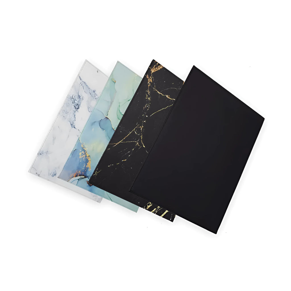 Anti-radiation printing tablet pad in colours black, black gold, blue, and green on a work surface.