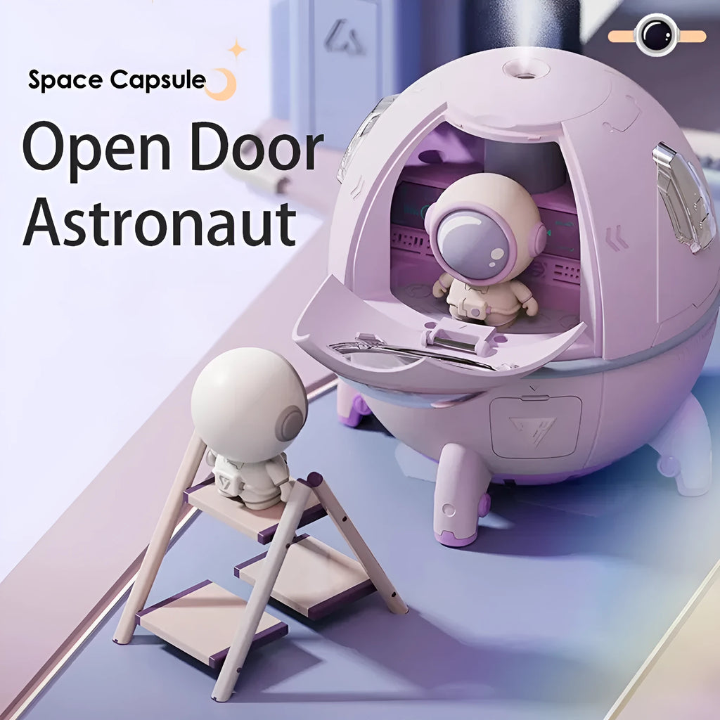 Astronaut-shaped USB desktop humidifier with colourful LED light on a desk.