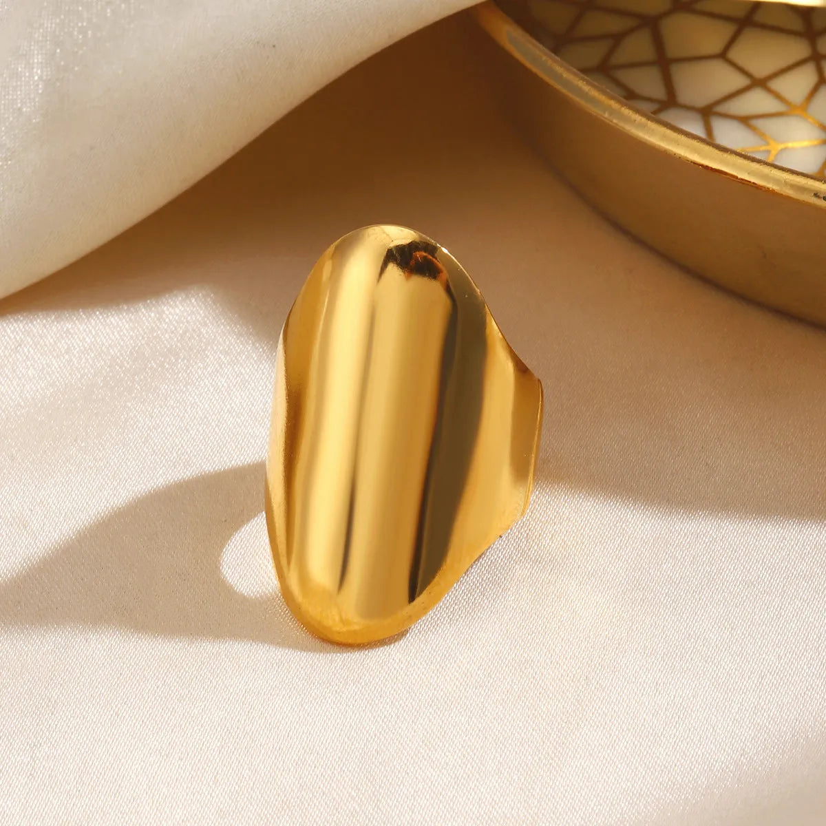 Exaggerated thick geometric stainless steel ring for women, available in gold and steel colour options
