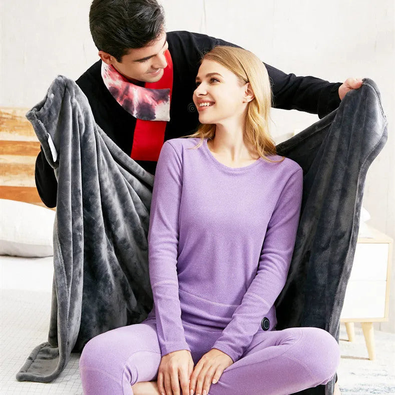 Dark grey USB electric heated blanket made from coral fleece, shown with a USB cable.