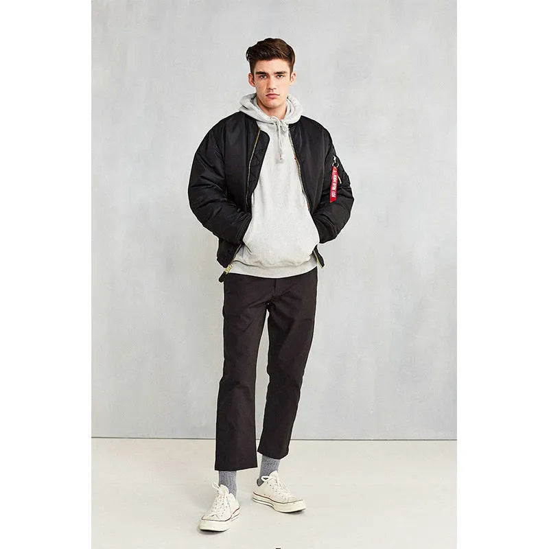 Men's loose fit nylon pilot jacket in Army Green shown on a hanger.