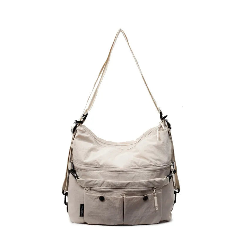 Women's nylon crossbody bag in square vertical shape with double shoulder straps and three-dimensional pockets