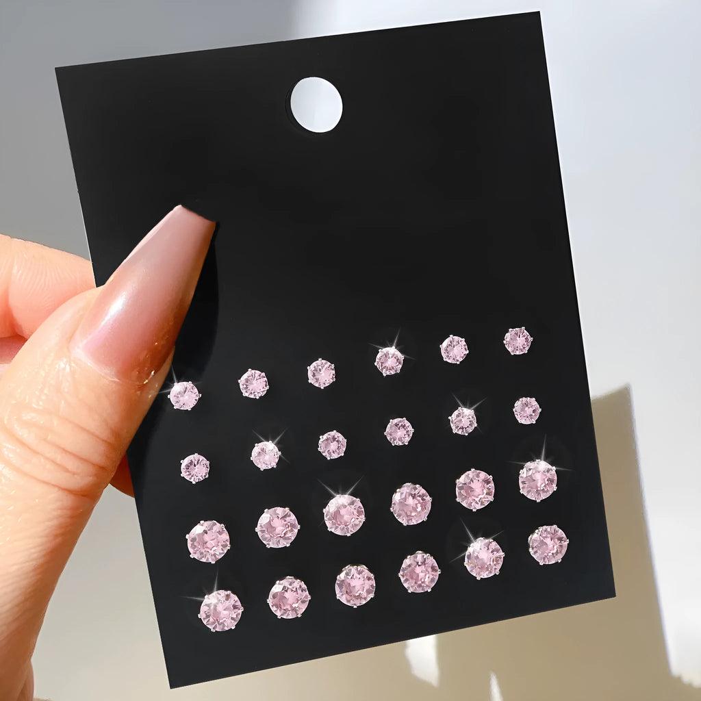Pink round women's earrings set with 12 pairs of alloy electroplated geometric studs on display