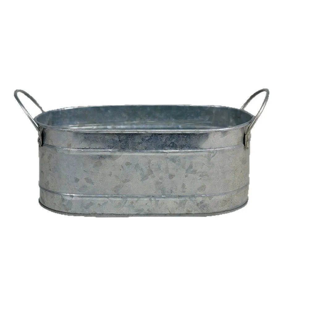 Iron sheet succulent flowerpot in a desktop style on a wooden surface.
