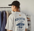 Men's loose fit plus size short-sleeved t-shirt in black, on a hanger.