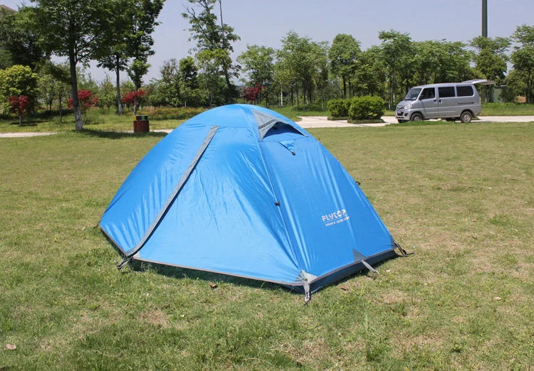 Double layer rainproof camping tent in green, orange, and blue for outdoor adventures